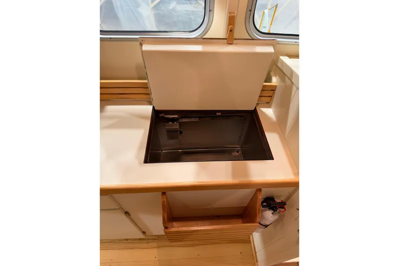 Chad-m Yacht Photos Pics Interior of 2022 Covey Island 38 Lobster Yacht with open storage compartment.