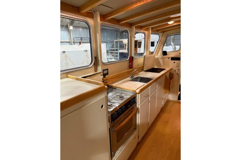 Chad-m Yacht Photos Pics Interior of 2022 Covey Island 38 Lobster Yacht with modern kitchen amenities.
