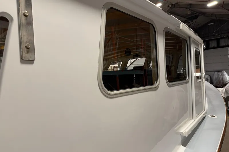 Chad-m Yacht Photos Pics Covey Island 38 Lobster Yacht 2022, side view in a boatyard setting.