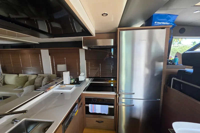  Yacht Photos Pics Luxurious kitchen interior of 2022 Prestige X70 yacht with modern appliances.