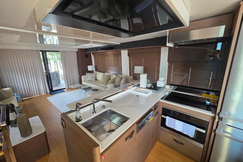  Yacht Photos Pics Luxurious interior of 2022 Prestige X70 yacht with modern kitchen and cozy living area.