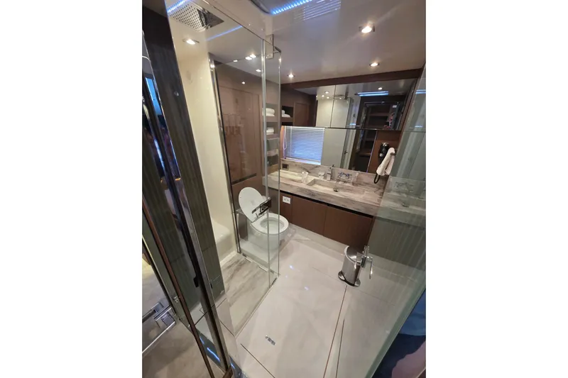  Yacht Photos Pics Luxurious bathroom in 2022 Prestige X70 yacht with modern fixtures and glass shower.
