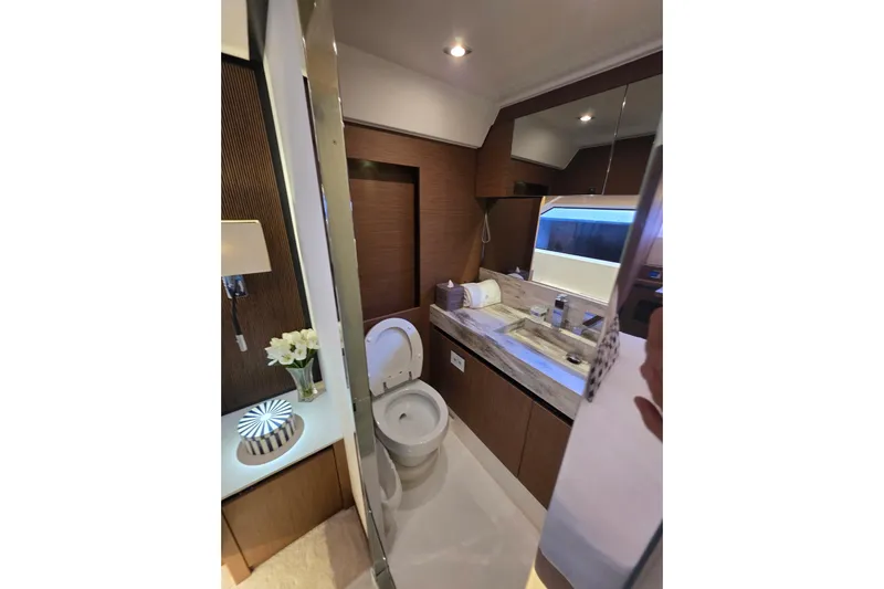  Yacht Photos Pics Luxurious bathroom interior of 2022 Prestige X70 yacht with modern fixtures and elegant design.