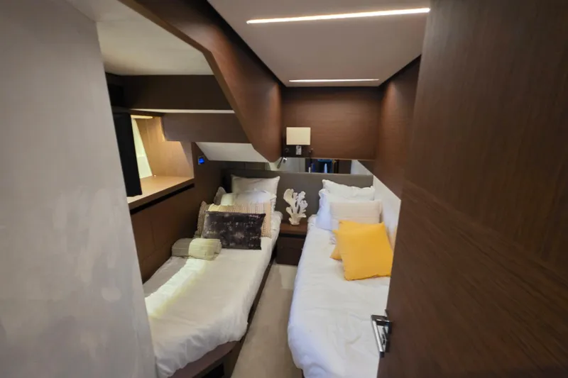  Yacht Photos Pics Luxurious cabin interior of 2022 Prestige X70 yacht with twin beds and modern decor.