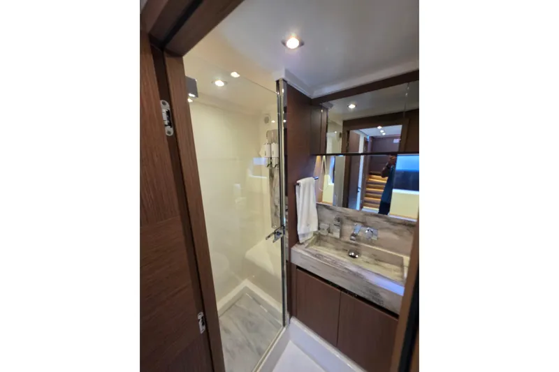  Yacht Photos Pics Luxurious bathroom in 2022 Prestige X70 yacht with modern fixtures and elegant design.