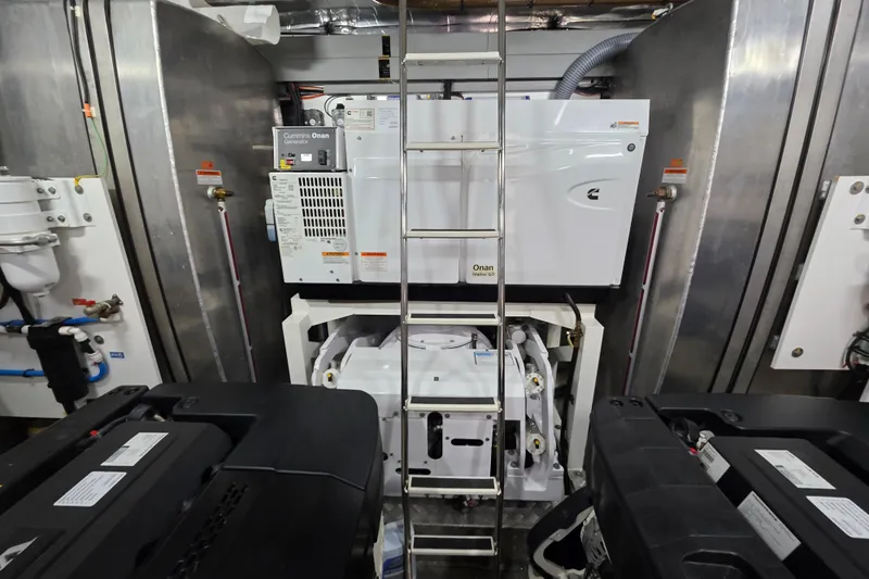  Yacht Photos Pics Engine room of 2022 Prestige X70 yacht with Cummins Onan generator and equipment.