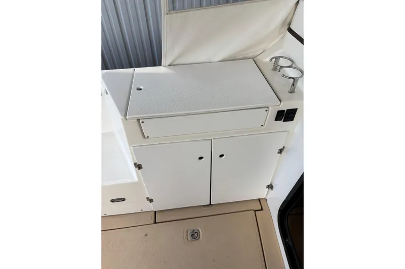  Yacht Photos Pics 2013 Cutwater C-28 boat interior with storage cabinets and cup holders.