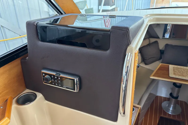  Yacht Photos Pics 2013 Cutwater C-28 interior with radio, cup holder, and cozy seating area.