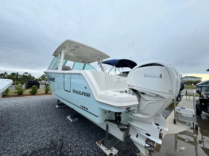  Yacht Photos Pics 2025 Sailfish 316 DC boat with Yamaha engines on display outdoors.