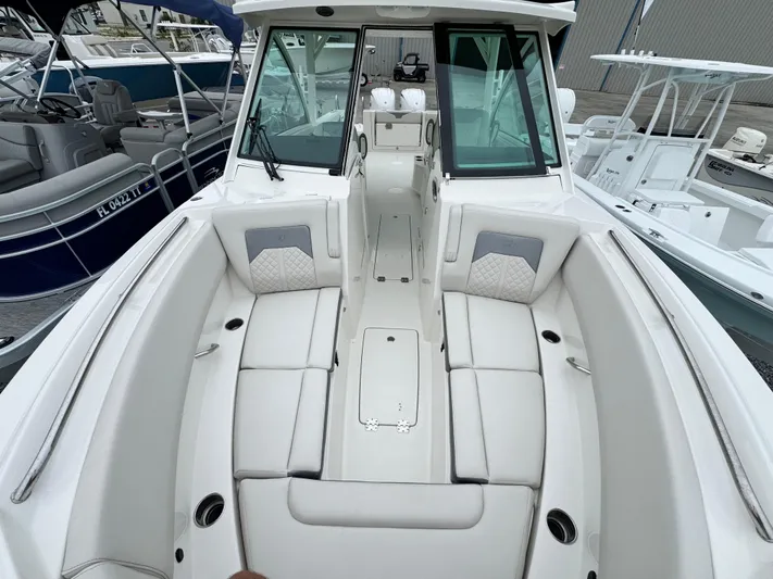  Yacht Photos Pics 2025 Sailfish 316 DC boat interior with white seating and modern design.
