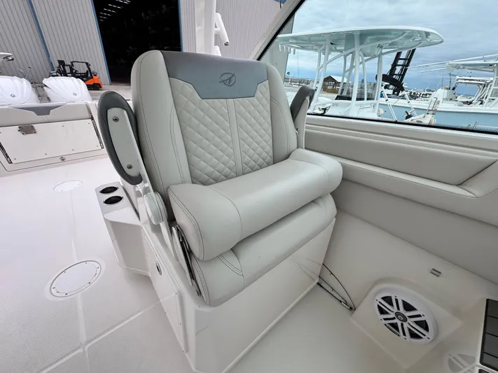  Yacht Photos Pics Luxury seating on 2025 Sailfish 316 DC boat, featuring quilted upholstery and modern design.