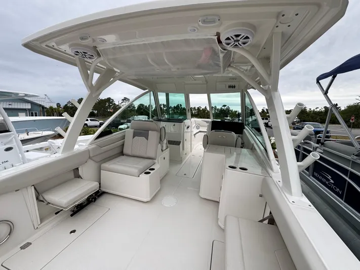  Yacht Photos Pics 2025 Sailfish 316 DC boat interior with spacious seating and modern design.