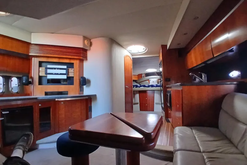 Yacht Photos Pics Luxurious interior of 2007 Cruisers Yachts 420 Express with elegant wood finishes.