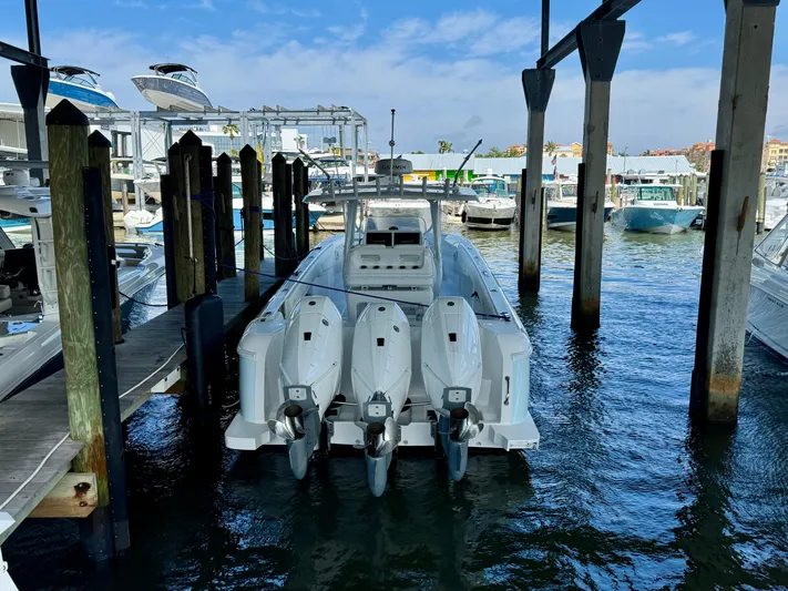 Yacht Photos Pics 2024 Intrepid 407 Nomad FE docked with triple outboard engines.