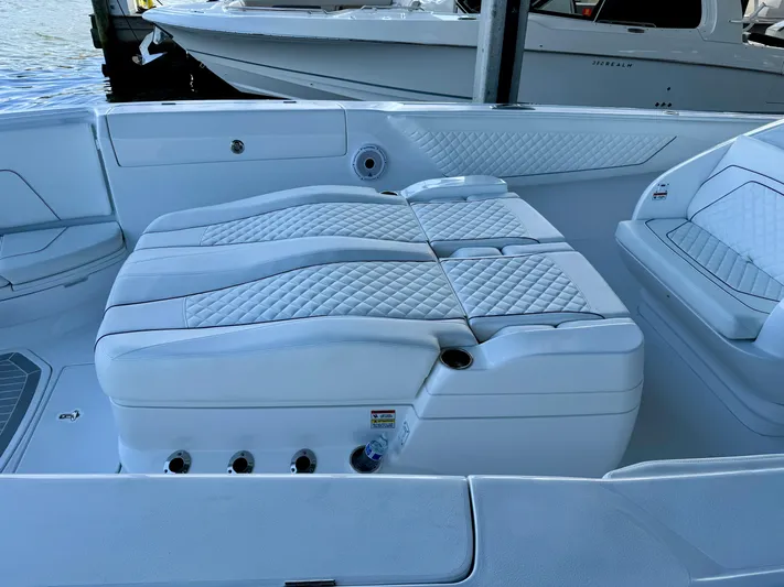  Yacht Photos Pics 2024 Intrepid 407 Nomad FE boat interior with white quilted seating.