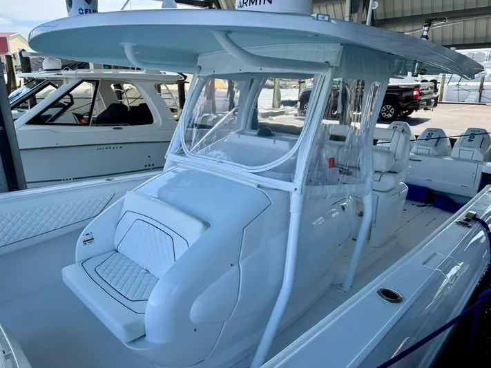  Yacht Photos Pics 2024 Intrepid 407 Nomad FE boat with sleek design and spacious deck.