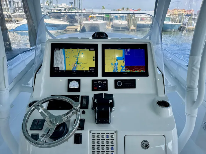  Yacht Photos Pics 2024 Intrepid 407 Nomad FE helm with dual navigation screens and controls.
