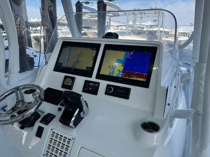  Yacht Photos Pics 2024 Intrepid 407 Nomad FE dashboard with navigation screens and controls.