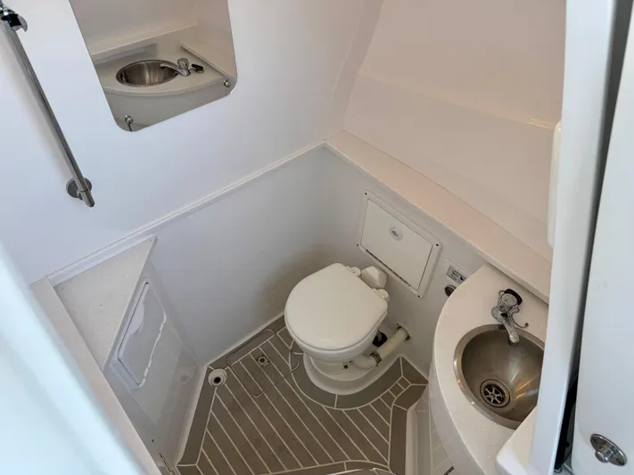  Yacht Photos Pics 2024 Intrepid 407 Nomad FE boat bathroom with toilet and sink.