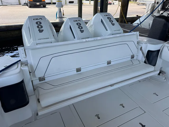  Yacht Photos Pics 2024 Intrepid 407 Nomad FE boat with triple Mercury 400 engines at dock.