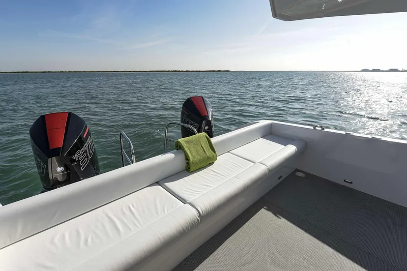  Yacht Photos Pics Luxury SilverCAT 34LUX boat deck with twin engines, 2026 model, on calm water.