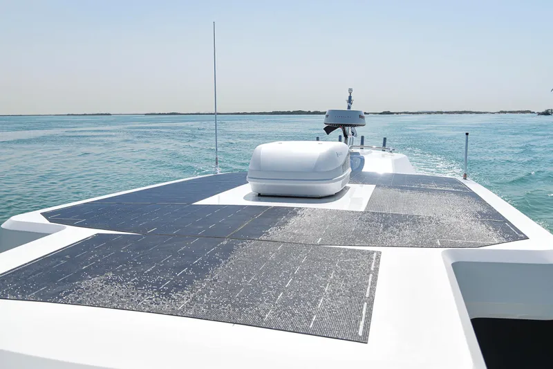  Yacht Photos Pics SilverCAT 34LUX 2026 yacht with solar panels on deck, cruising on calm blue waters.