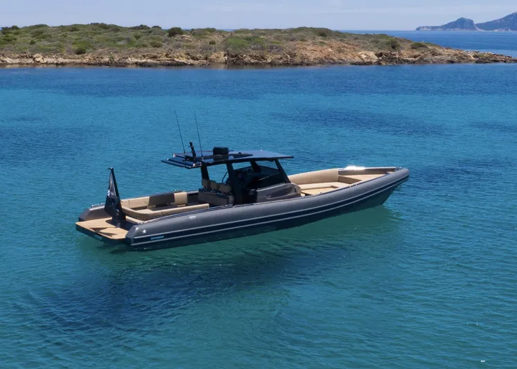 Black Shiver 120 Efb Yacht Photos Pics Novamarine Black Shiver 120 Diesel 2025 boat on clear blue water near rocky island.