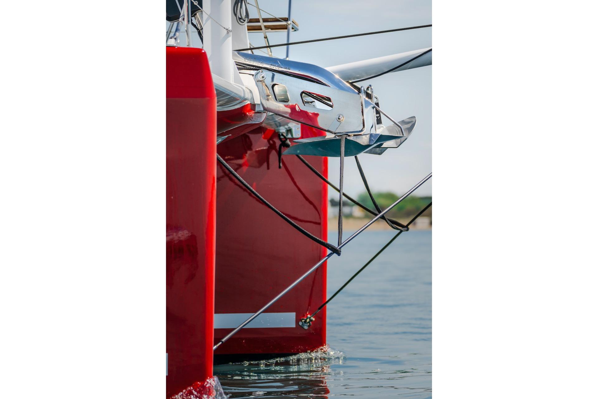 Red bow of a 2025 Privilege Signature 510 catamaran.