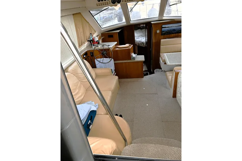  Yacht Photos Pics Interior of 2001 Carver 356 Motor Yacht with beige seating and helm station.