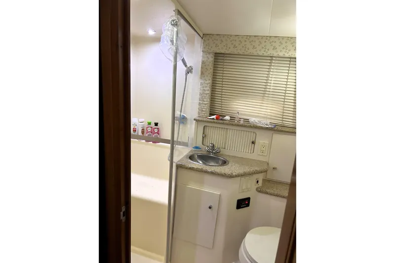  Yacht Photos Pics Bathroom interior of 2001 Carver 356 Motor Yacht with sink, shower, and toiletries.