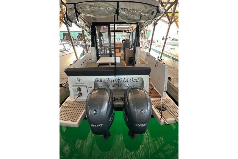 Mauka Makai Yacht Photos Pics 2021 Jeanneau NC 895 boat with twin Yamaha 200 engines, docked in Seattle.