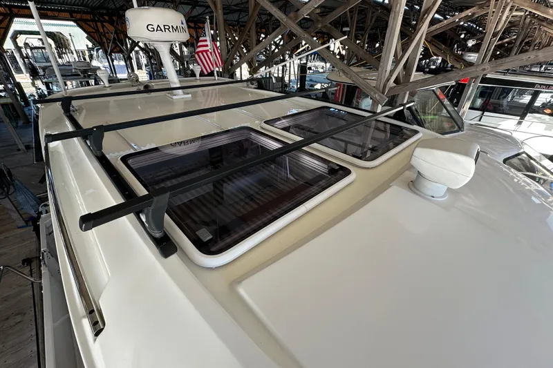 Mauka Makai Yacht Photos Pics 2021 Jeanneau NC 895 boat roof with Garmin radar and skylights in marina.