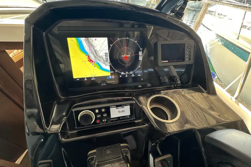 Mauka Makai Yacht Photos Pics 2021 Jeanneau NC 895 helm with navigation screens and controls.