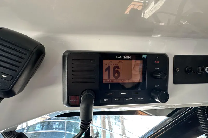 Mauka Makai Yacht Photos Pics Garmin marine radio on 2021 Jeanneau NC 895, displaying channel 16 distress signal.
