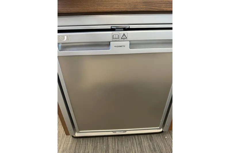 Mauka Makai Yacht Photos Pics Dometic refrigerator in 2021 Jeanneau NC 895 boat interior.