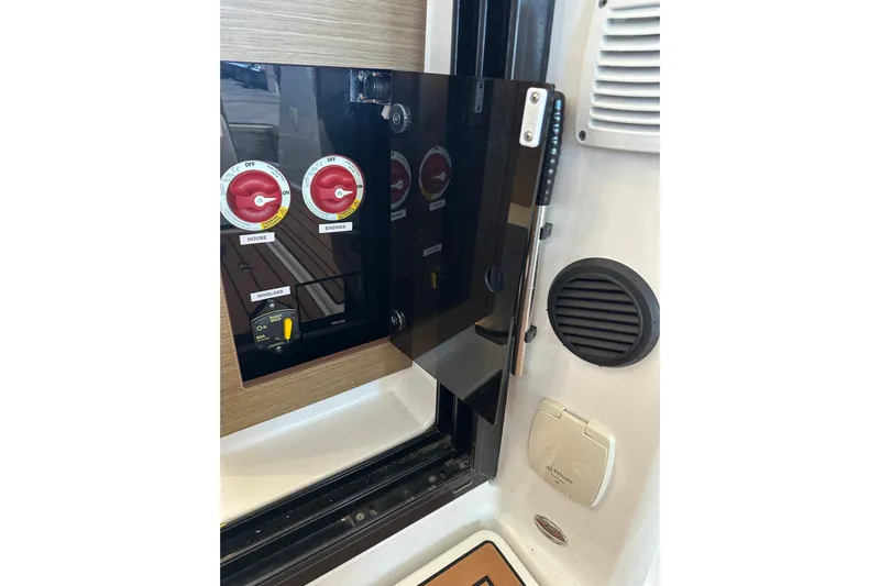 Mauka Makai Yacht Photos Pics Control panel on a 2021 Jeanneau NC 895 boat, featuring switches and dials.