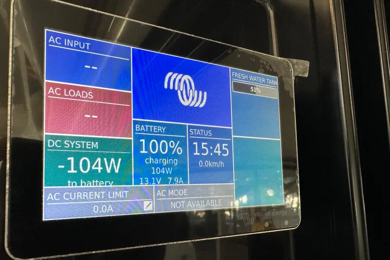 Mauka Makai Yacht Photos Pics Display screen on 2021 Jeanneau NC 895 showing battery and water tank status.
