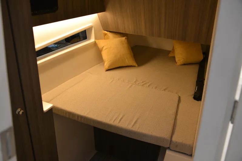  Yacht Photos Pics 2023 World Cat 400DC-X cabin interior with cozy bed and pillows.