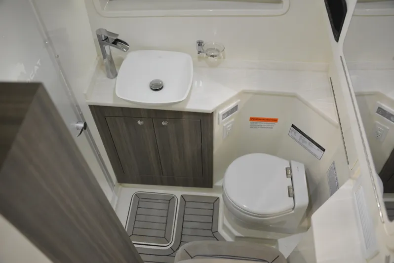  Yacht Photos Pics 2023 World Cat 400DC-X boat bathroom with modern sink and toilet design.
