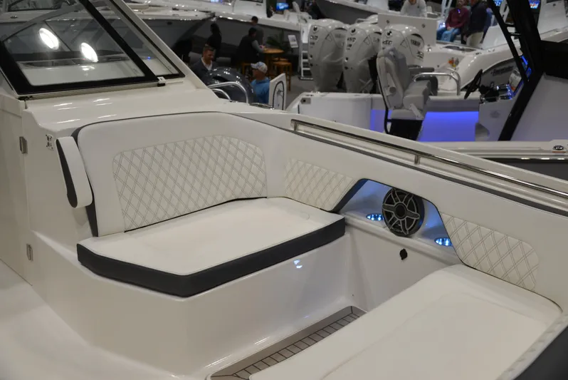  Yacht Photos Pics 2023 World Cat 400DC-X boat interior with white seating and speaker system.