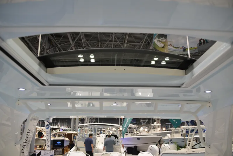  Yacht Photos Pics 2023 World Cat 400DC-X boat interior at a boat show, showcasing modern design and lighting.