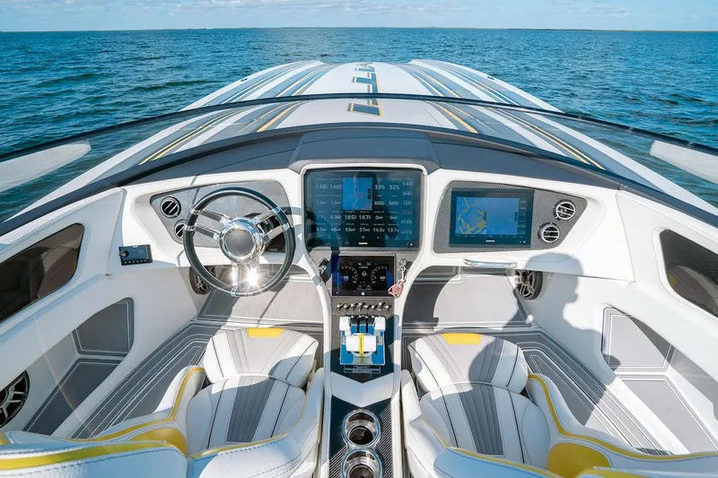  Yacht Photos Pics Luxury MTI 390X 2022 boat cockpit with advanced navigation system on open water.