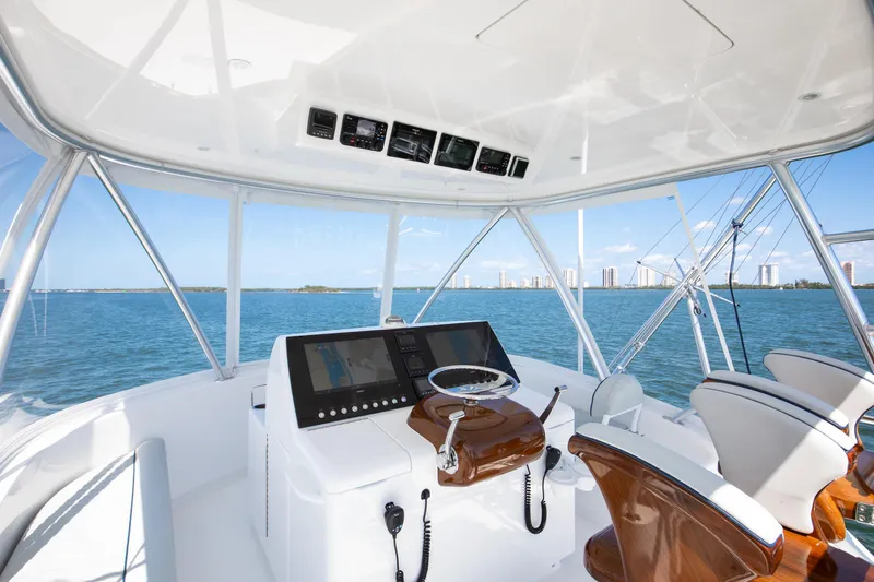 Can Do Yacht Photos Pics Helm of 2023 Viking 46 Billfish yacht with ocean view and modern controls.