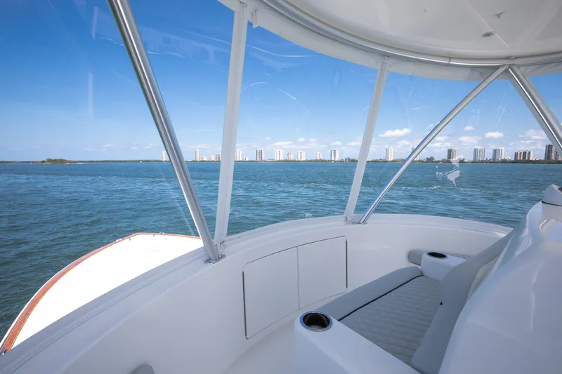 Can Do Yacht Photos Pics View from 2023 Viking 46 Billfish yacht, overlooking ocean and city skyline.
