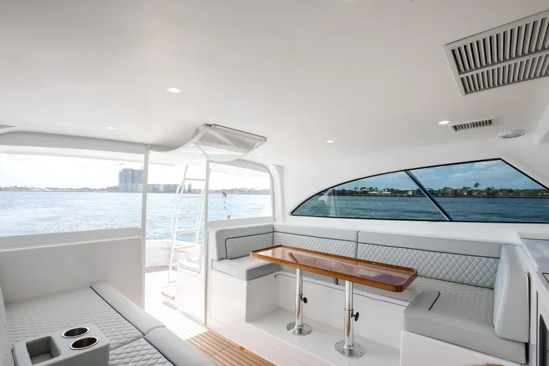 Can Do Yacht Photos Pics Luxurious interior of 2023 Viking 46 Billfish yacht with elegant seating and ocean view.