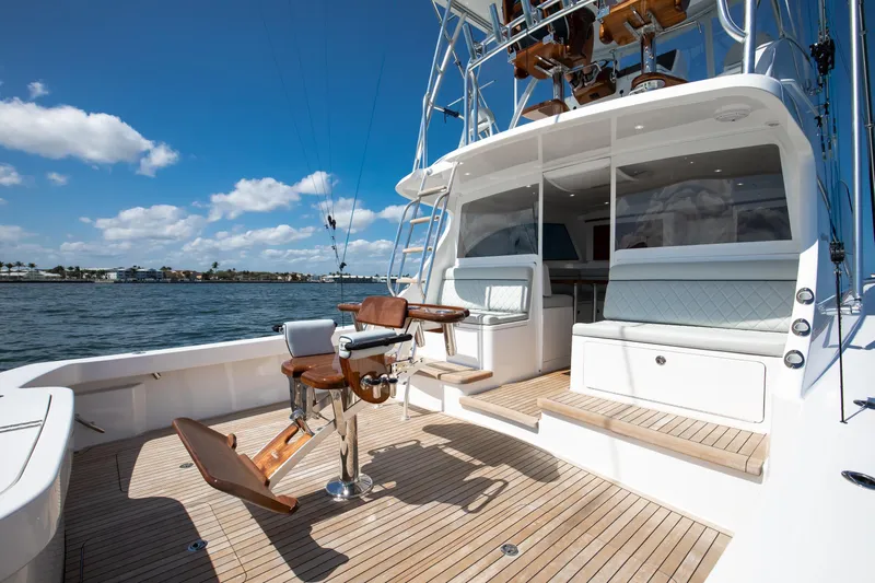Can Do Yacht Photos Pics 2023 Viking 46 Billfish yacht deck with fishing chair and ocean view.