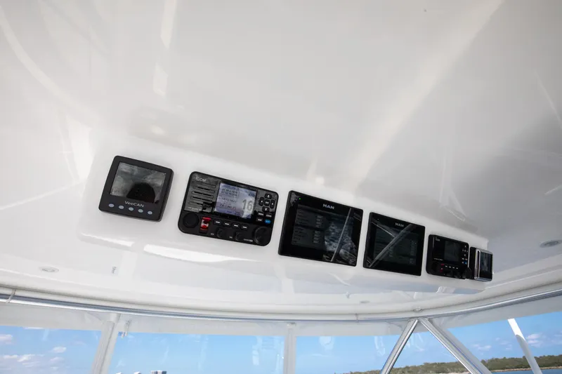 Can Do Yacht Photos Pics Control panel of 2023 Viking 46 Billfish with multiple electronic displays.