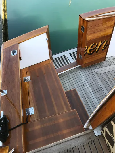  Yacht Photos Pics Wooden deck of 1977 Monk McQueen 72 CPMY yacht with open door and water view.