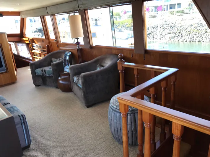  Yacht Photos Pics Interior of 1977 Monk McQueen 72 CPMY yacht with plush seating and large windows.