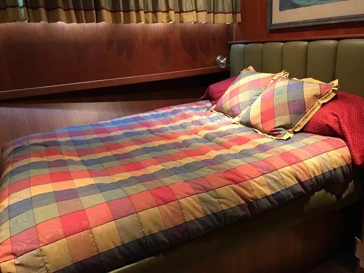  Yacht Photos Pics Cozy cabin bed with colorful checkered bedding on 1977 Monk McQueen 72 CPMY yacht.